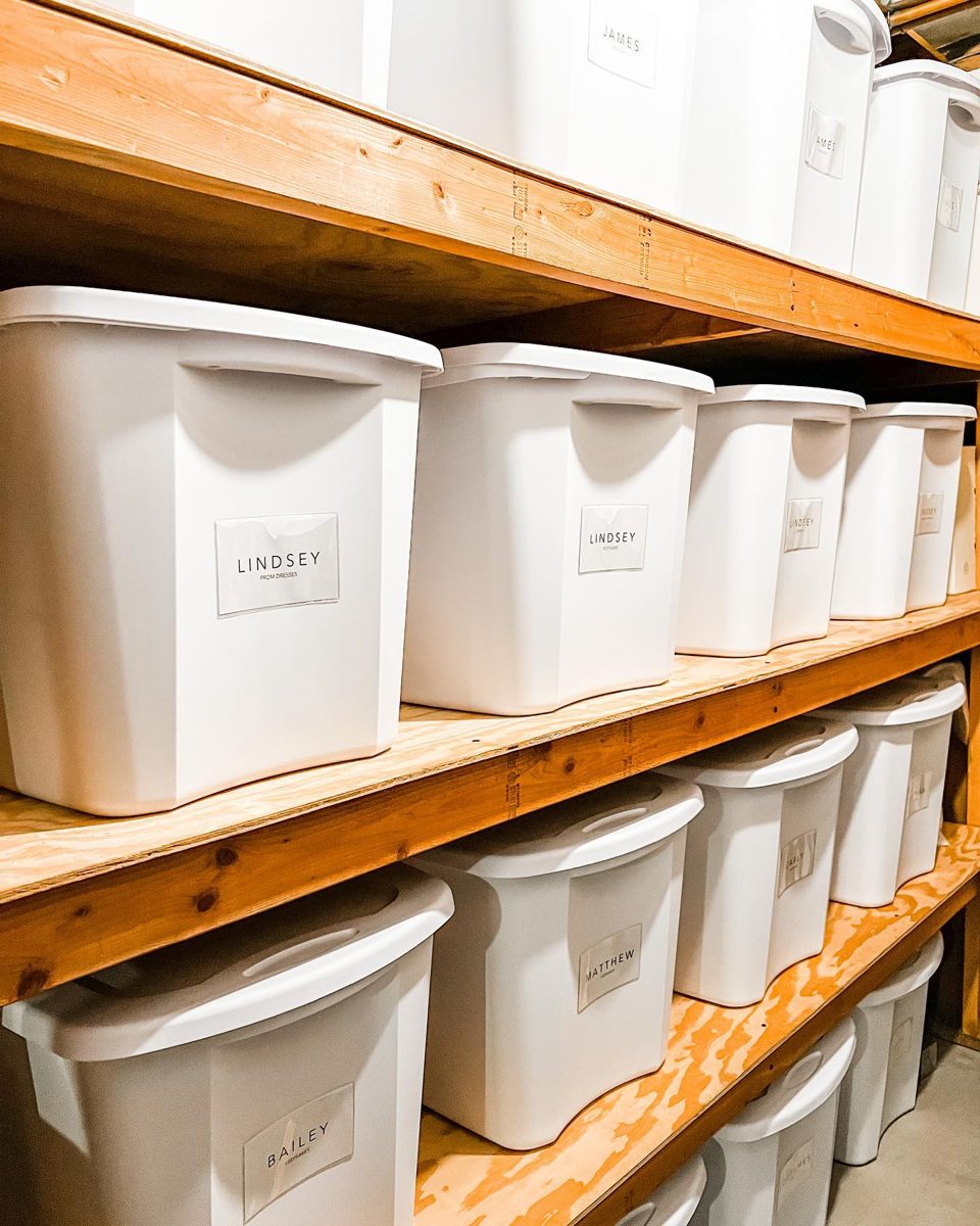 Storage room with labeled keepsake bins for each family member