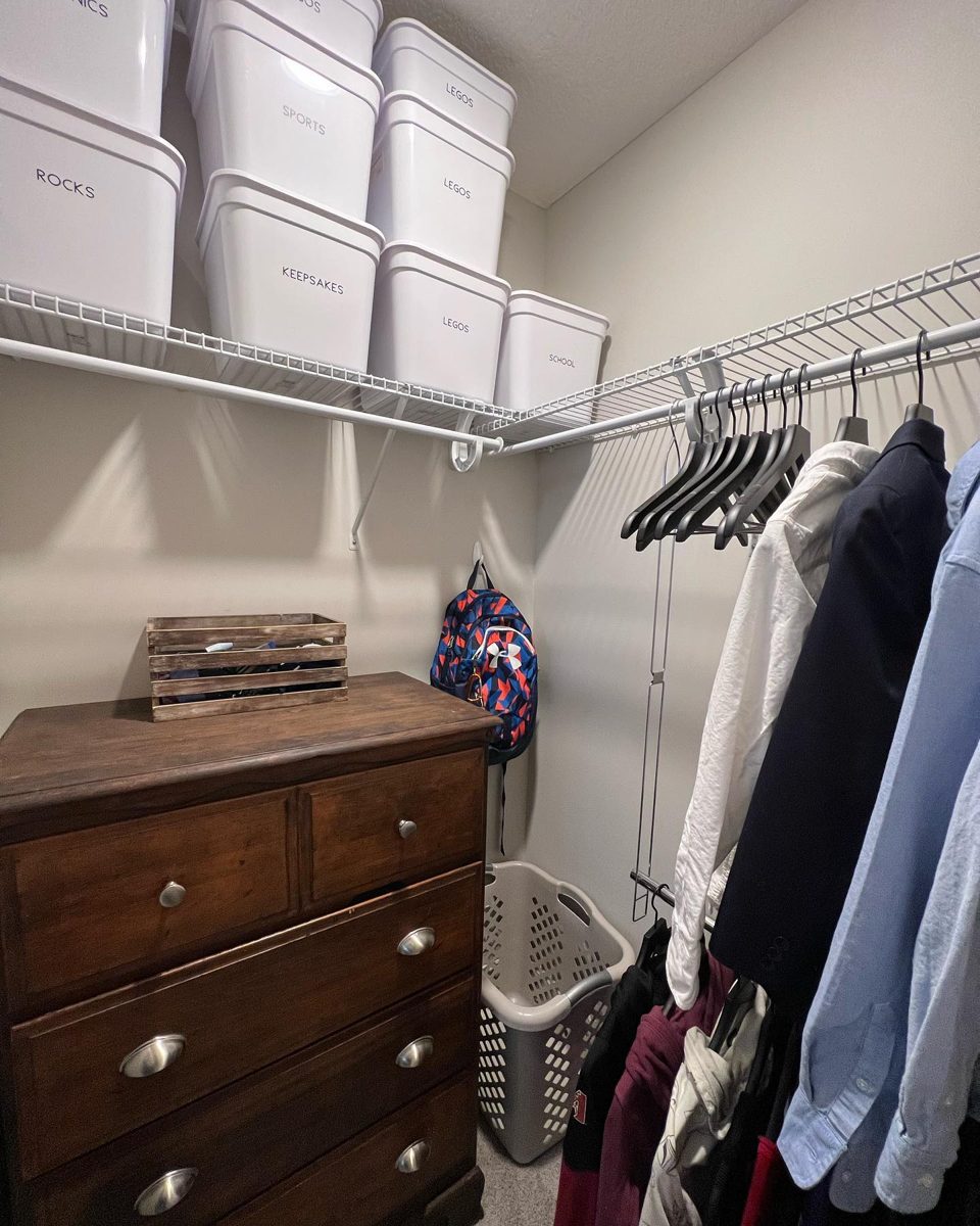 Kid's closet with labeled bins for Legos, rocks, keepsakes, and school