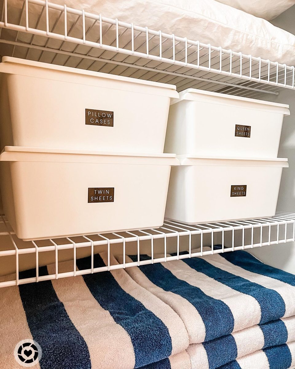 Linen closet with labeled bins for sheets and pillowcases
